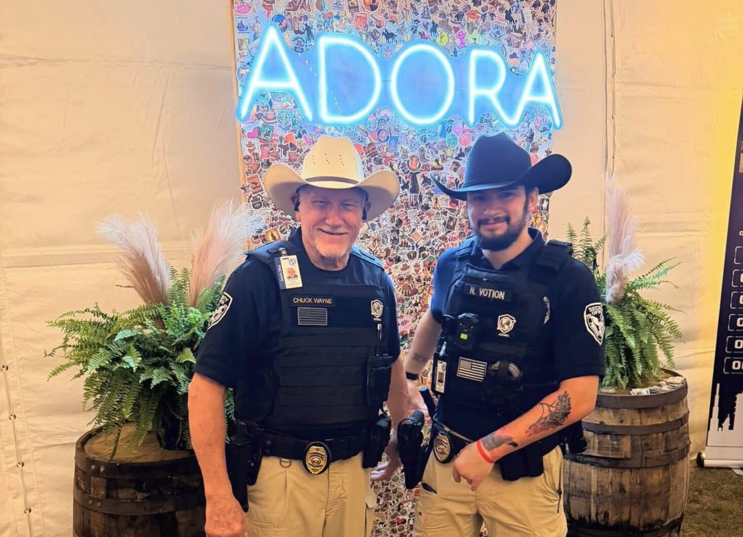 Two security officers standing next to each other at an event